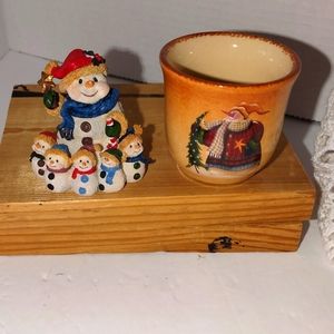 Little snowman figurine and a snowman votive holder
